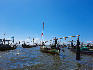 traditional boats on the harbor in the mid day