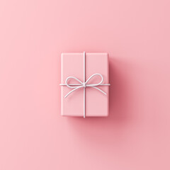 Minimal pink gift box with white rope ribbon bow isolated on pink pastel color background with shadow minimalist conceptual 3D rendering