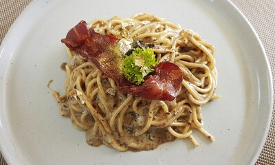 Truffle Cheese Cream Pasta Topped with Bacon.