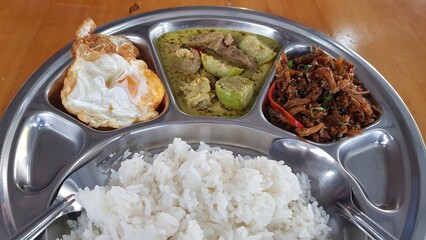Thai curry rice in a divided tray.