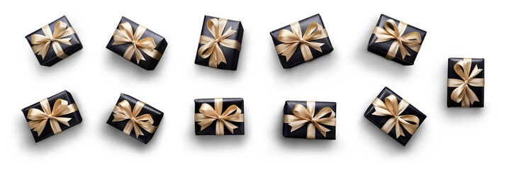 Top view of Christmas, birthday presents wrapped in black paper with gold ribbon and bow decoration isolated against a transparent background.