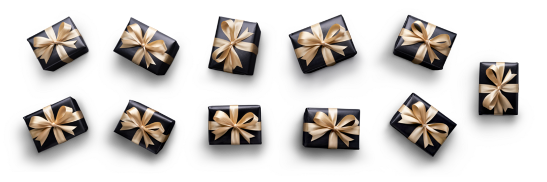Top view of Christmas, birthday presents wrapped in black paper with gold ribbon and bow decoration isolated against a transparent background.