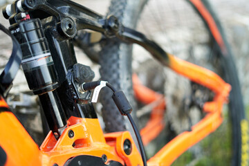 Close up of an e-bike plugged in charging