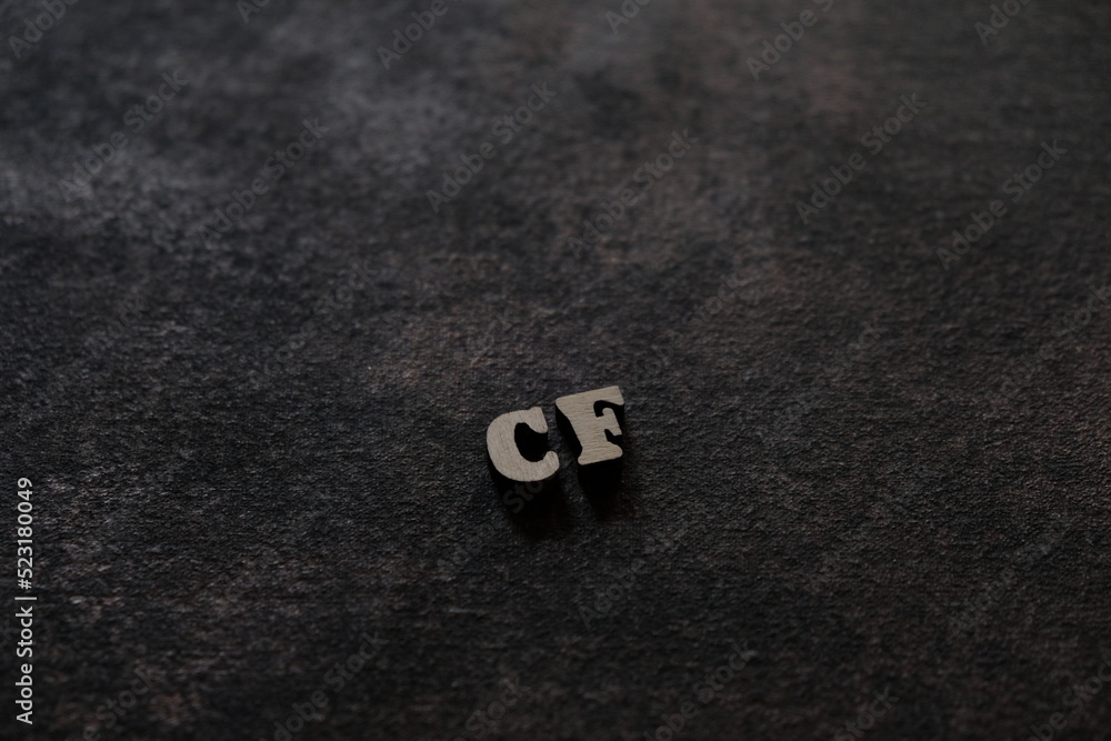 Poster the letters c and f above the dark field. initials cf