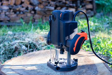 Electric milling machine. Power tool. Manual wood router. Hand tool. Woodworking tool.