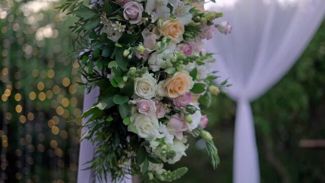 Flowers decorating chuppah on wedding