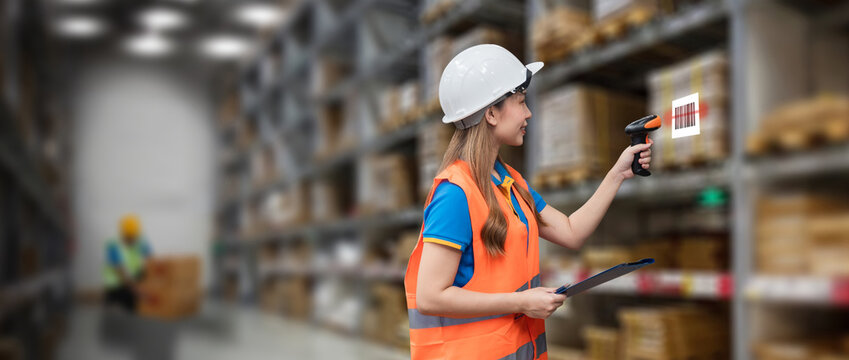 woman manager professional smiling of warehouse logistic worker job check scanning barcode on parcel box in distribution factory. logistic business delivery stock in storehouse to shipment occupation 