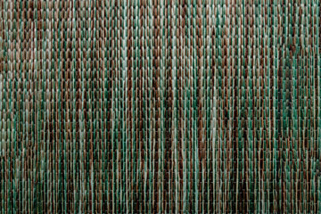 Background with intertwined different threads, close up. The structure of dense fabric with texture. Fabric background.