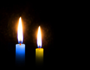 Candles on a black background. Sorrow and memory.