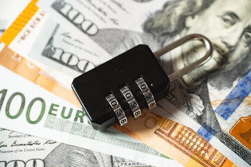 The concept of protection of funds, assets and capitals. The lock lies on money.