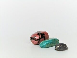 Stones with flowers on a white background