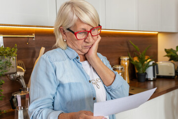 Upset of elderly woman received a utility bill for gas or electricity. Bank loan debt, tax payment...