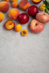 Apricots pearches plums fruits from above food concrete