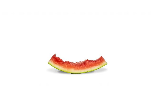 Watermelon being eaten on a white background. stop motion animation.