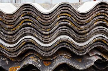 A stack of wave slate. Gray wavy slate. Slate Roofing. Home construction, corrugated roof, profiled sheeting