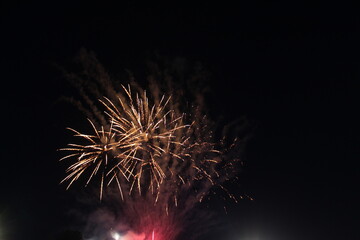 Fireworks fireworks on a black dark background. Holiday atmosphere. Independence Day Celebration