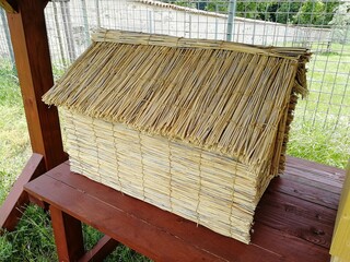  Old historical type of beehive made of reeds used in traditional beekeeping

