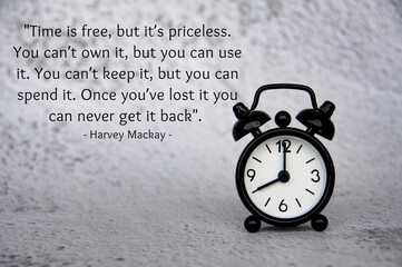 Motivational and inspirational quote about time and life with alarm clock pointing at 8 am. Time...