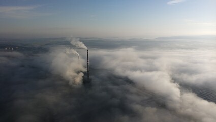 smoke from a factory chimney above inversion cloud layer,Czech republic,Europe,aerial panorama...