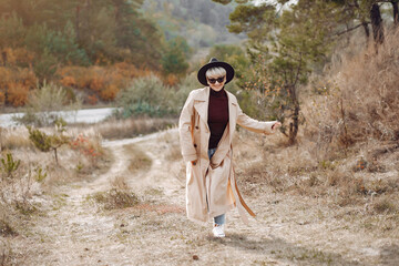 Cute girl have a rest in a autumn park