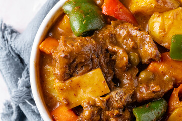 Kaldereta or caldereta is a goat meat stew from the Philippines. Variations of the dish use beef, chicken, or pork. Commonly, the goat meat is stewed with vegetables and liver paste. 