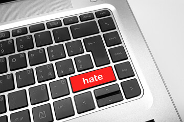 close up view of keyboard with hate red button
