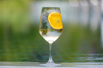 Refreshing fruity and alcoholic summer cocktail on dark background