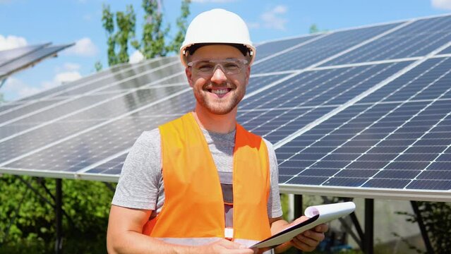 Engineers checking solar panels. Alternative energy ecological concept