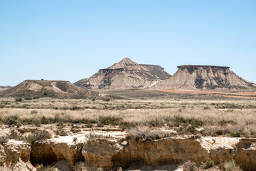 mounds and plateaus fomed in a semi-desert natural region or badlands composing clay, chalk and sandstone