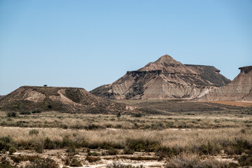 mounds and plateaus fomed in a semi-desert natural region or badlands composing clay, chalk and...