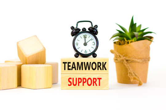 Teamwork support symbol. Concept words Teamwork support on wooden blocks on a beautiful white table white background. Black alarm clock. Business and teamwork support concept. Copy space.