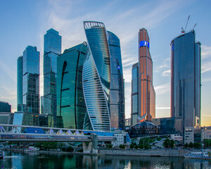 Obraz na płótnie Canvas Moscow City skyscrapers on the river, business center summer evening Russia