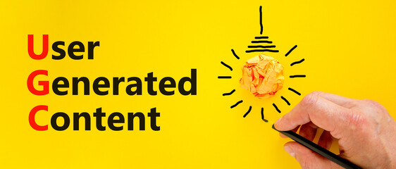 UGC user generated content symbol. Concept words UGC user generated content on a beautiful yellow...