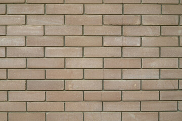 Brick wall of a house as a background, bricks as texture
