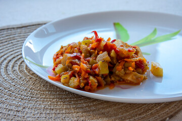 ratatouille, vegetable stew on a plate, diet food, keto recipe