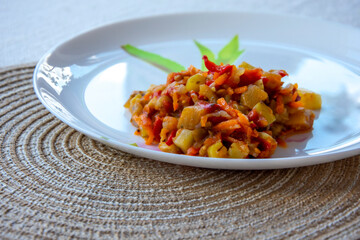 ratatouille, vegetable stew on a plate, diet food, keto recipe