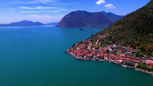 Italian lakes scenery. Iseo lake . Aerial drone view of beautiful Monte Isola island and Peschiera Maraglio village. Italy, Brescia province