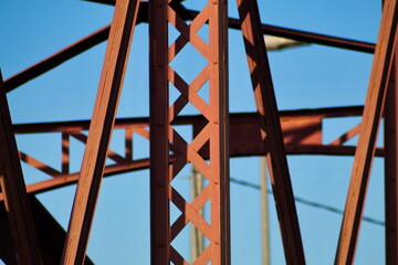 Metal structure of an old bridge with a useful design to support the weight of cars and trucks that cross the river