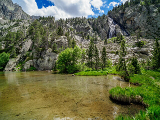 Escarpinosa green lake and waterfall in Benasque Valley, Spain