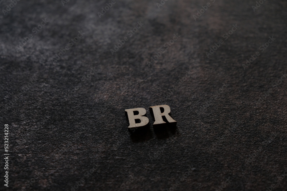 Poster the letters b and r above the dark field. initials br
