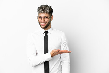 Business caucasian man isolated on white background presenting an idea while looking smiling towards