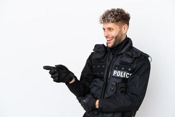 SWAT caucasian man isolated on white background pointing finger to the side and presenting a product