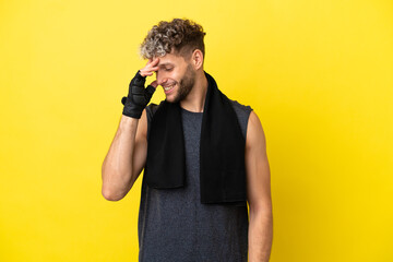 Sport caucasian man isolated on yellow background laughing