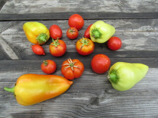 peppers and tomatoes on a wooden background