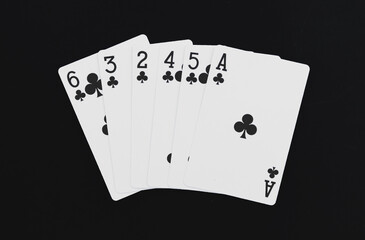 Royal Flush playing cards on a black background.