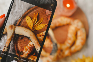 TAKING A PICTURE OF FRESH BREAD
