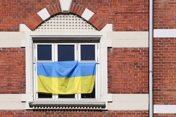 Ukrainian flag at a window in Aarhus, Denmark