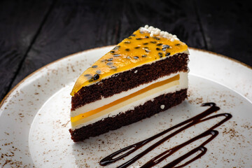 delicious cake with cream on a wooden background