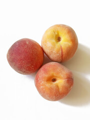 Naklejka na ściany i meble juicy ripe peaches on white background 