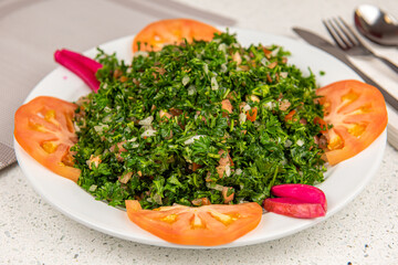 Healthy vegetarian salad bowl. This healthy dish mixes tabbouleh & greek style salads, using fresh parsley herb, olives, onions, feta and replacing the bulgur usually found in tabouleh with quinoa.